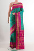 Blue Rajkot Patola Silk Saree with Pure Ikat on the body and Zari Border.  displayed on a mannequin