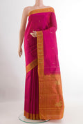 Pink Kanchipuram Silk Saree with Zari Butta on the body and Zari Border.  displayed on a mannequin