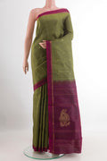 Mehandi Green Kanchipuram Silk Saree with Zari Butta on the body and Zari Border.  displayed on a mannequin