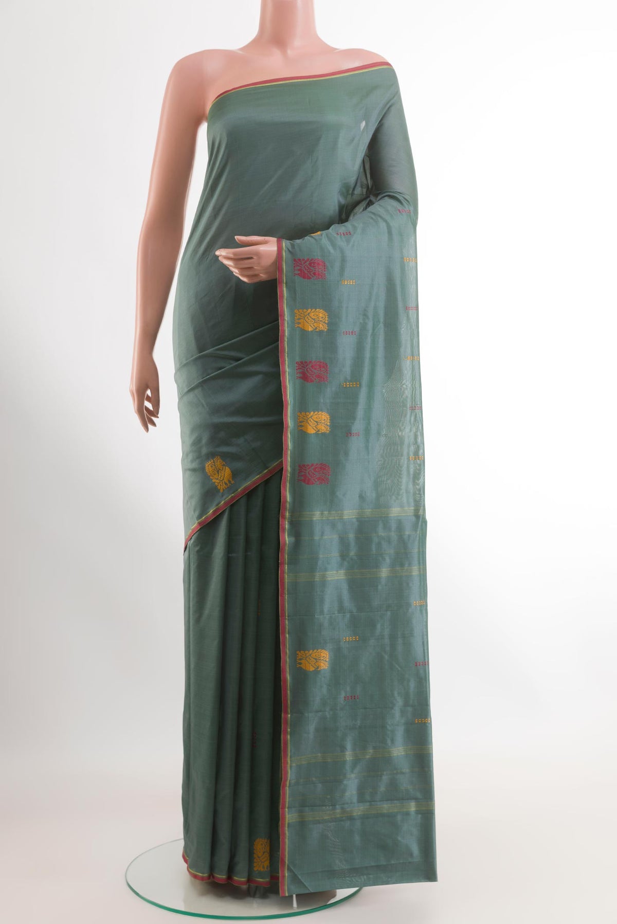 Grey Kanchipuram Silk Saree with Thread Butta on the body and Thread Border.  displayed on a mannequin