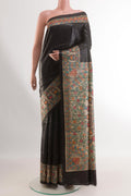 Black Tussar Silk Saree with Plain Body and Printed Border.  displayed on a mannequin