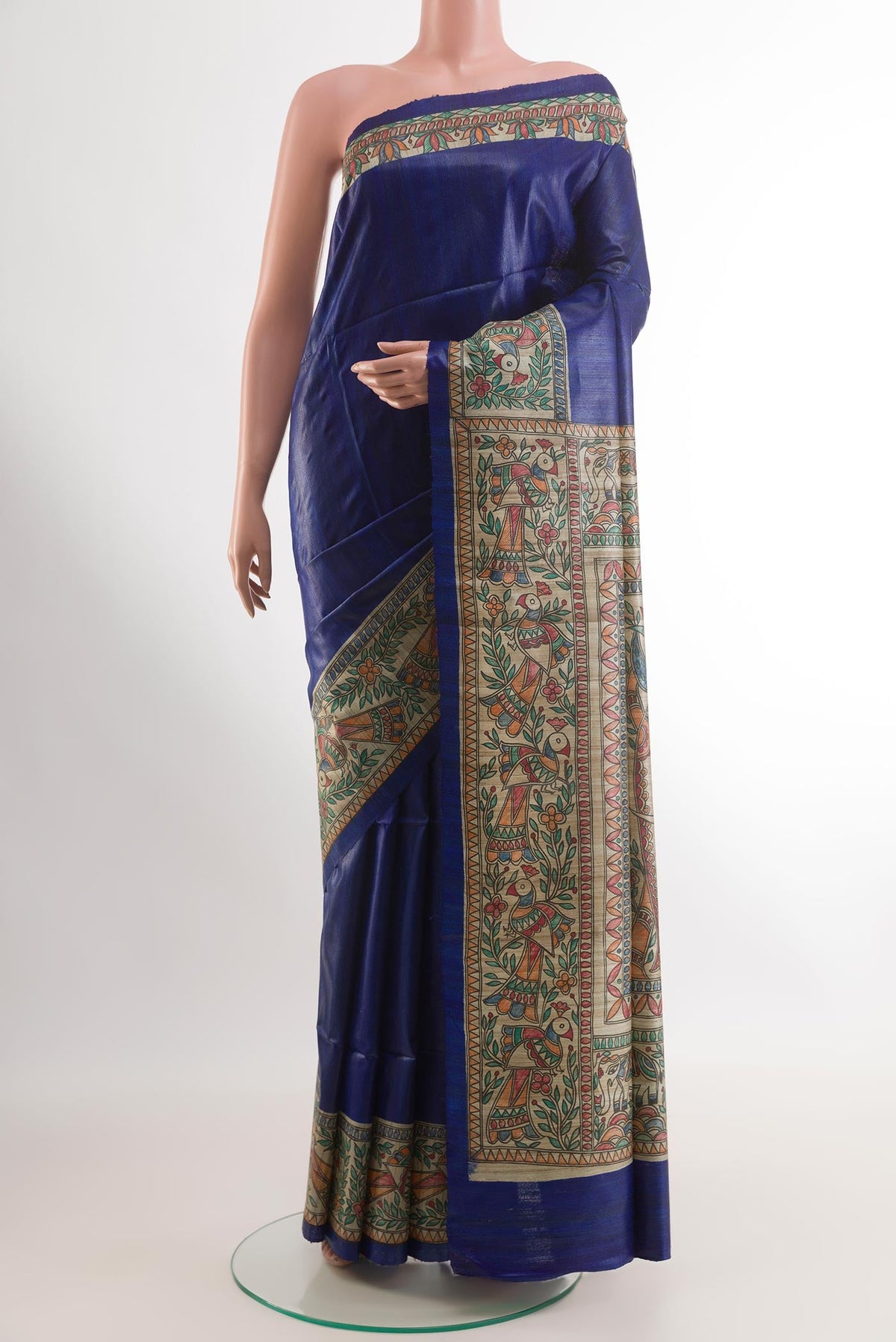 Blue Tussar Saree with Plain Body and Printed Border.  displayed on a mannequin