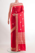 Red Banarasi Katan Silk Saree with Zari Butta on the body and Zari Border.  displayed on a mannequin