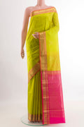 Light Green Kanjivaram Silk Saree with Zari Butta on the body and Zari Border.  displayed on a mannequin