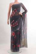 Grey Chiffon Saree with Printed design on the body and Zari Border.  displayed on a mannequin