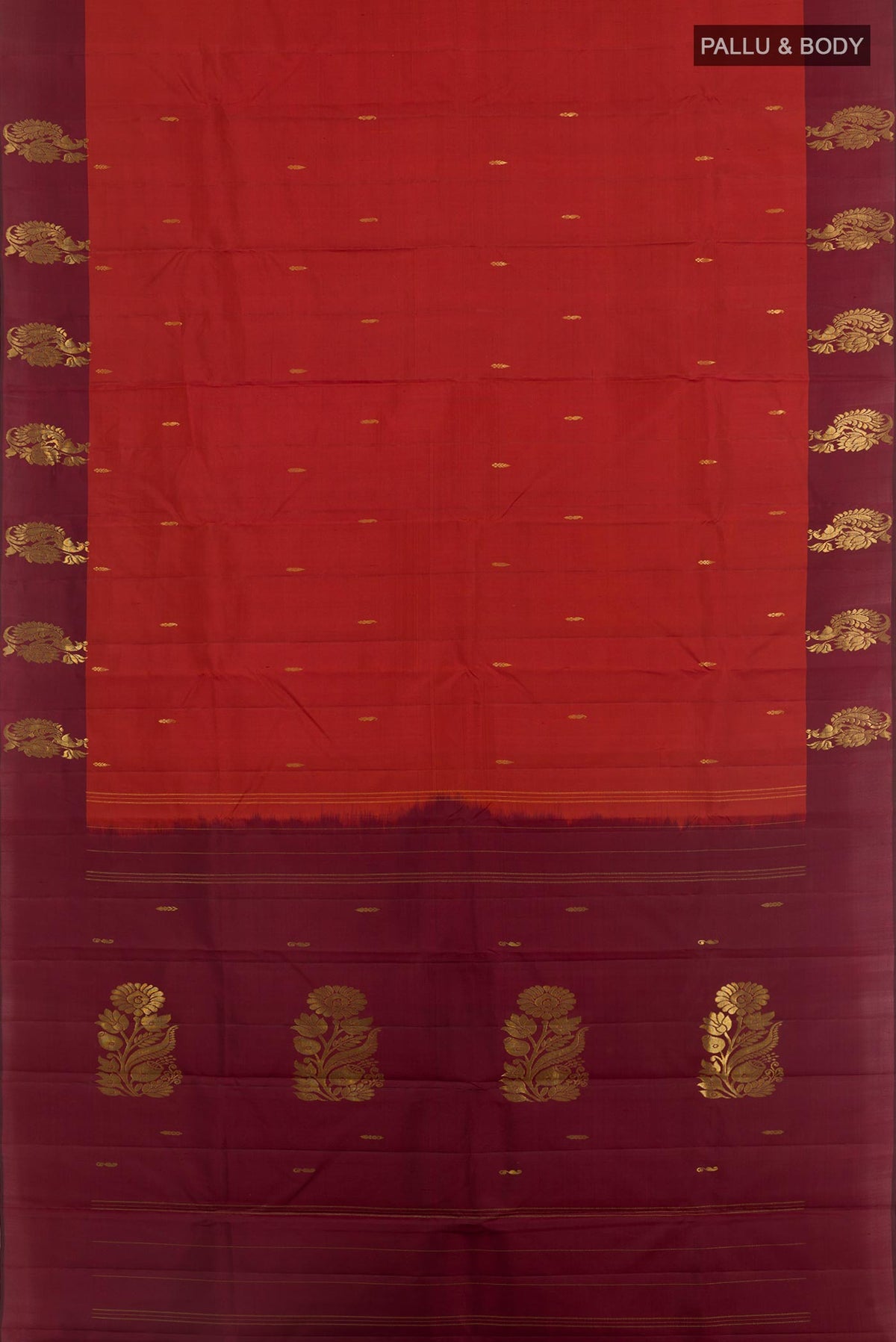 Flat view of Rust Kanchipuram Silk Saree with Zari Butta on the body and Zari Border. 