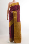 Maroon Kanchipuram Silk Saree with Zari Butta on the body and Zari Border.  displayed on a mannequin