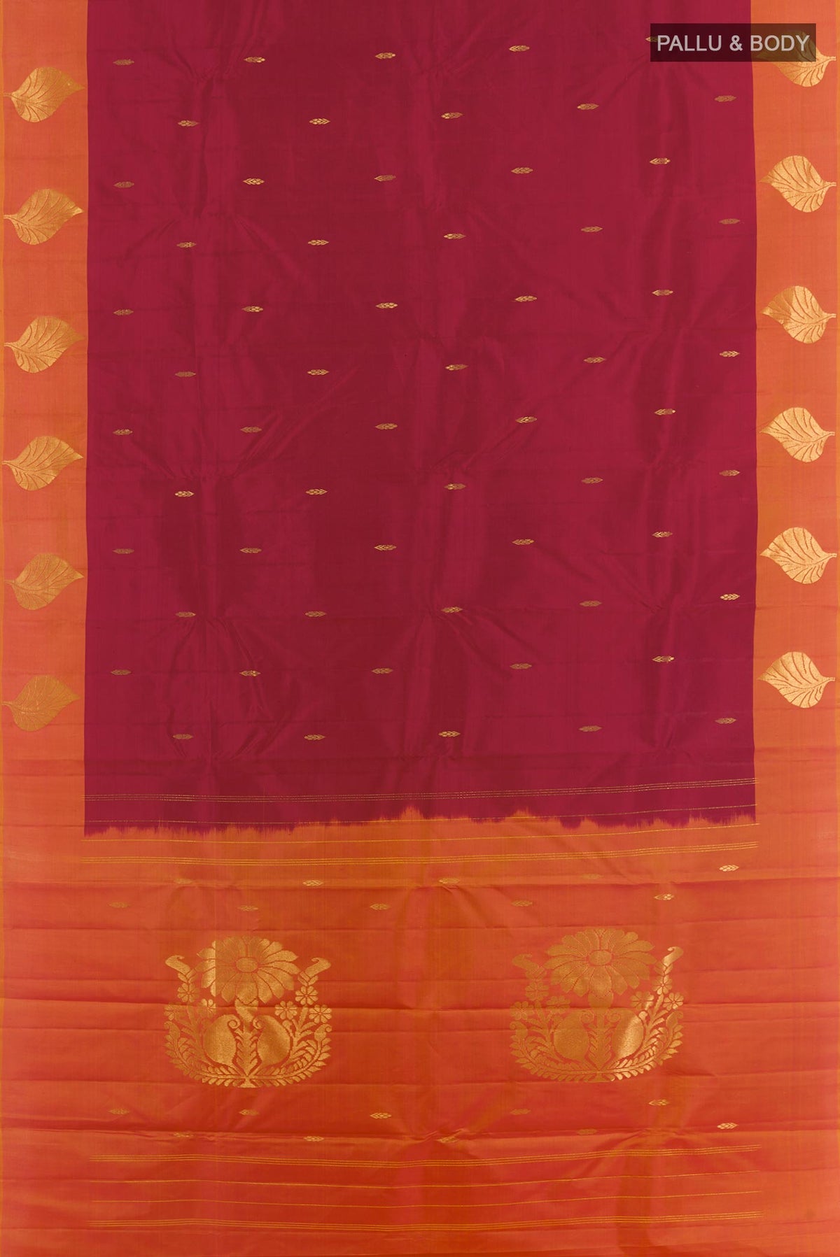 Flat view of Maroon Kanchipuram Silk Saree with Zari Butta on the body and Zari Border. 