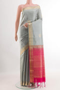 Grey Soft Silk Saree with Zari Butta on the body and Zari Border.  displayed on a mannequin