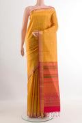 Yellow Soft Silk Saree with Zari Butta on the body and Zari Border.  displayed on a mannequin
