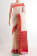 Off White Soft Silk Saree with Zari Butta on the body and Zari Border.  displayed on a mannequin