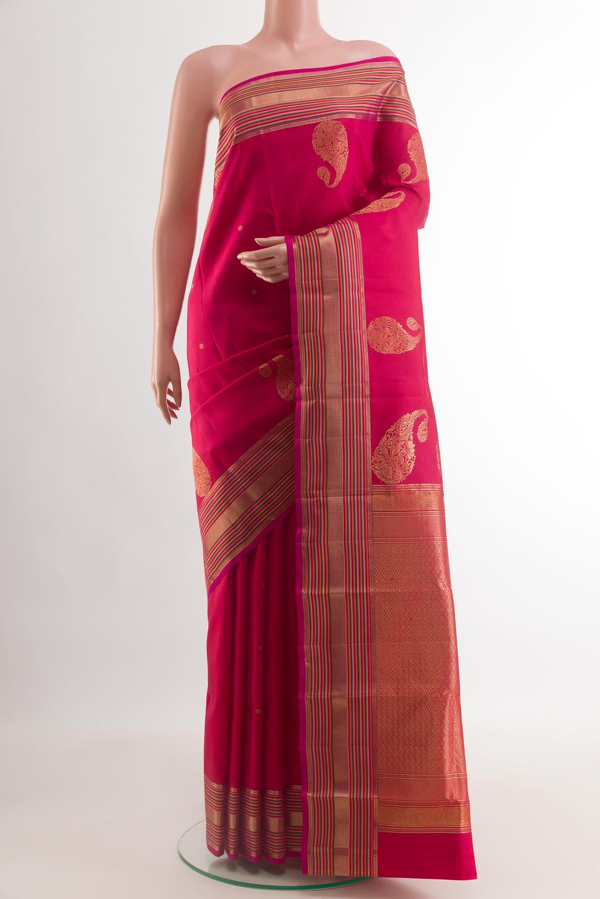 Pink Kanchipuram Silk Saree with Zari Butta on the body and Zari Border.  displayed on a mannequin