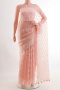 Pink Organza Silk Saree with Zari Butta on the body and Embroidery Border.  displayed on a mannequin