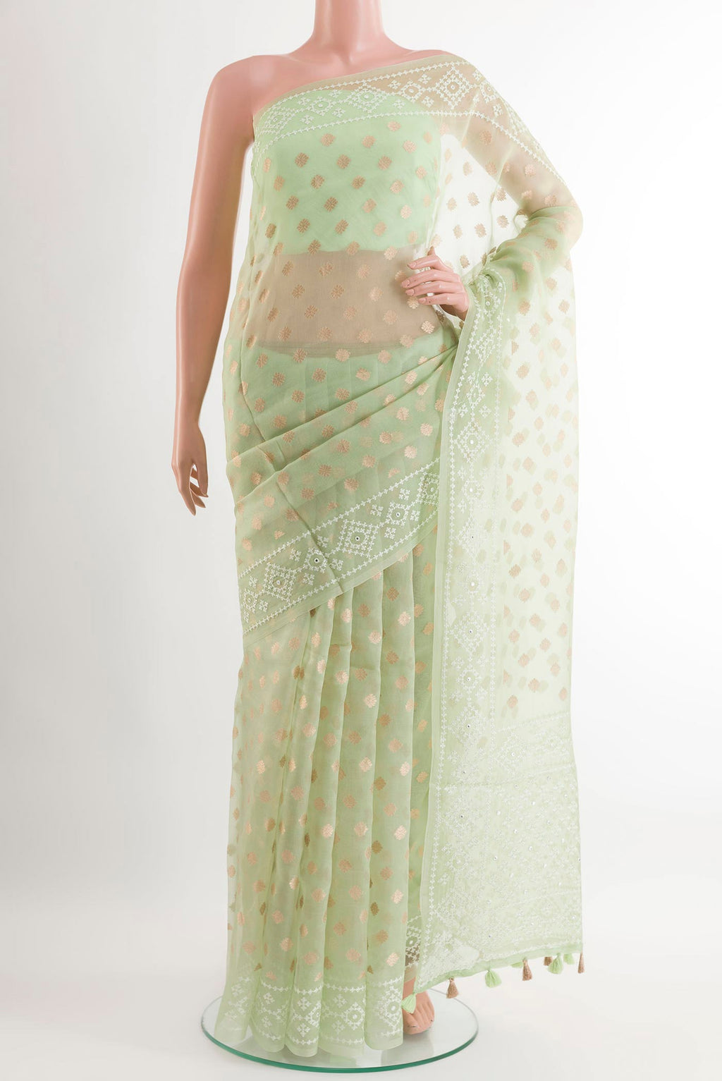 Green Organza Silk Saree with Zari Butta on the body and Embroidery Border.  displayed on a mannequin