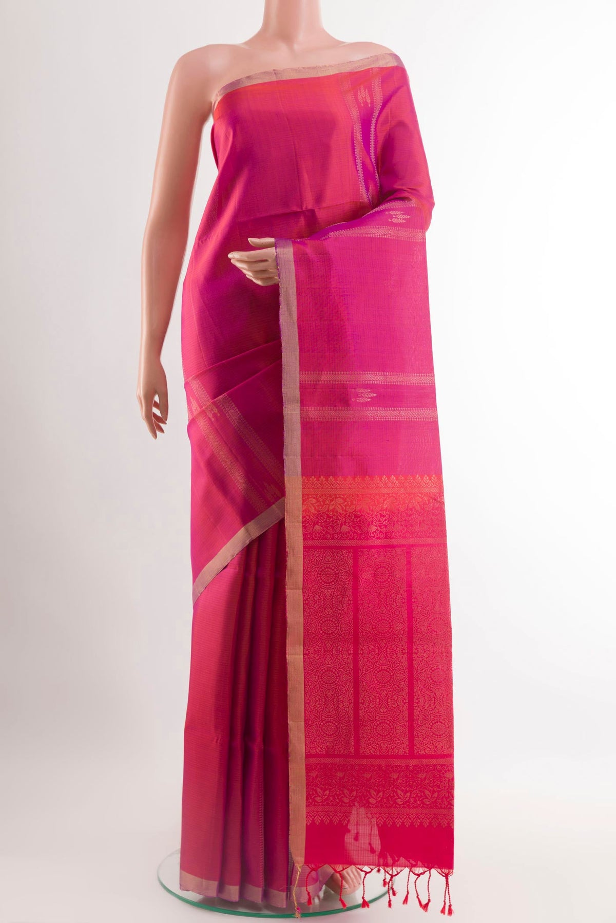 Pink Soft Silk Saree with Zari Butta on the body and Zari Border.  displayed on a mannequin