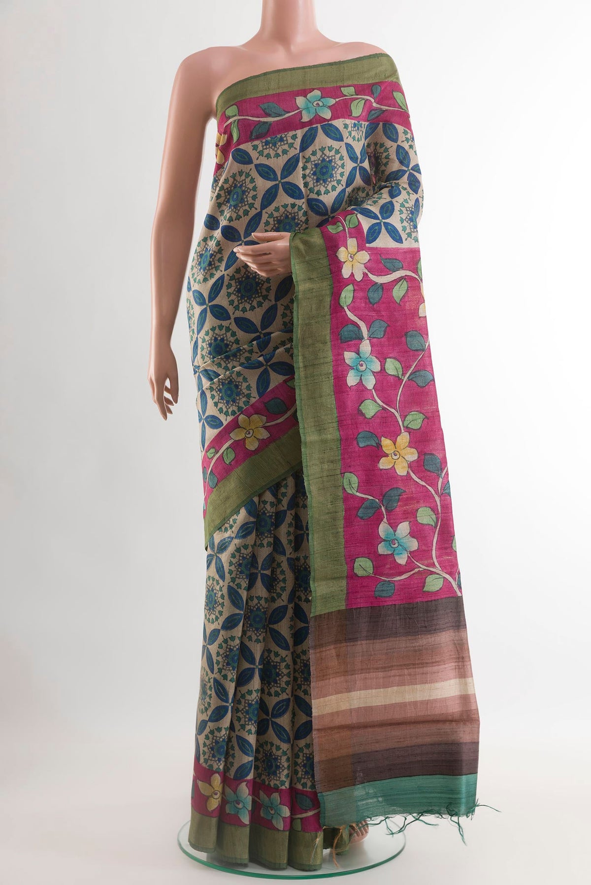 Multi Color Tussar Saree with Printed design on the body and Zari Border.  displayed on a mannequin