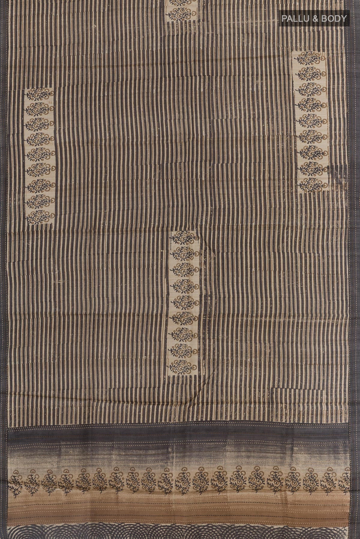 Flat view of Black Tussar Saree with Printed design on the body and Embroidery Border. 