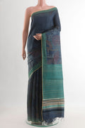Blue Tussar Saree with Printed design on the body and Embroidery Border.  displayed on a mannequin