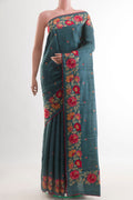 Blue Grey Tussar Saree with Thread Butta on the body and Embroidery Border.  displayed on a mannequin