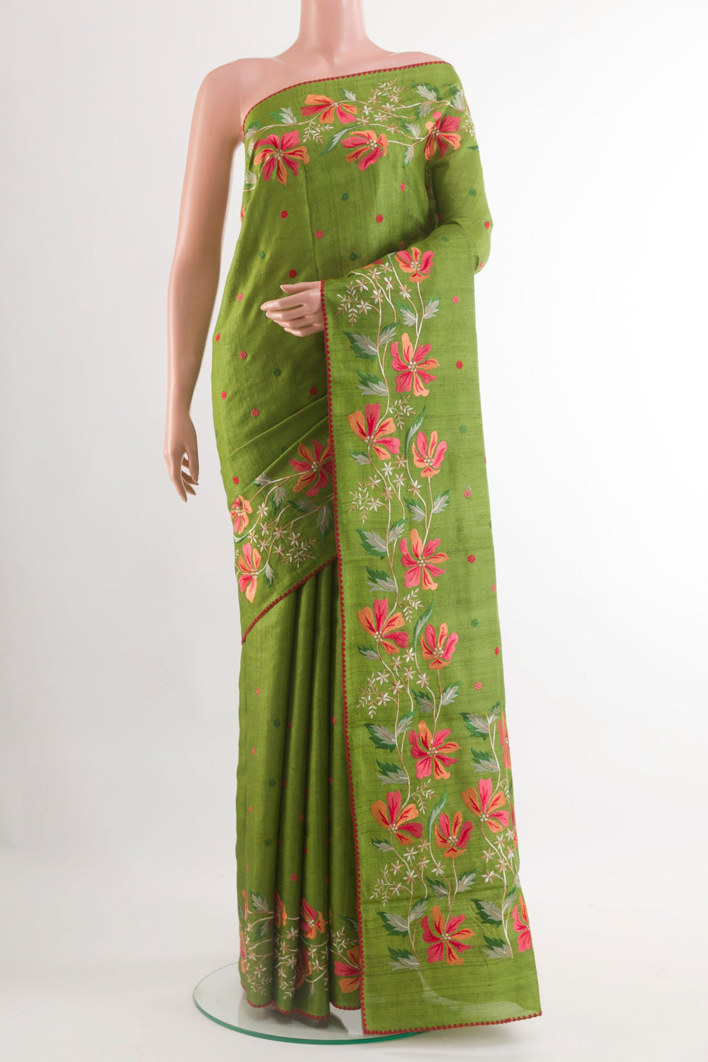 Green Tussar Saree with Thread Butta on the body and Zari Border.  displayed on a mannequin