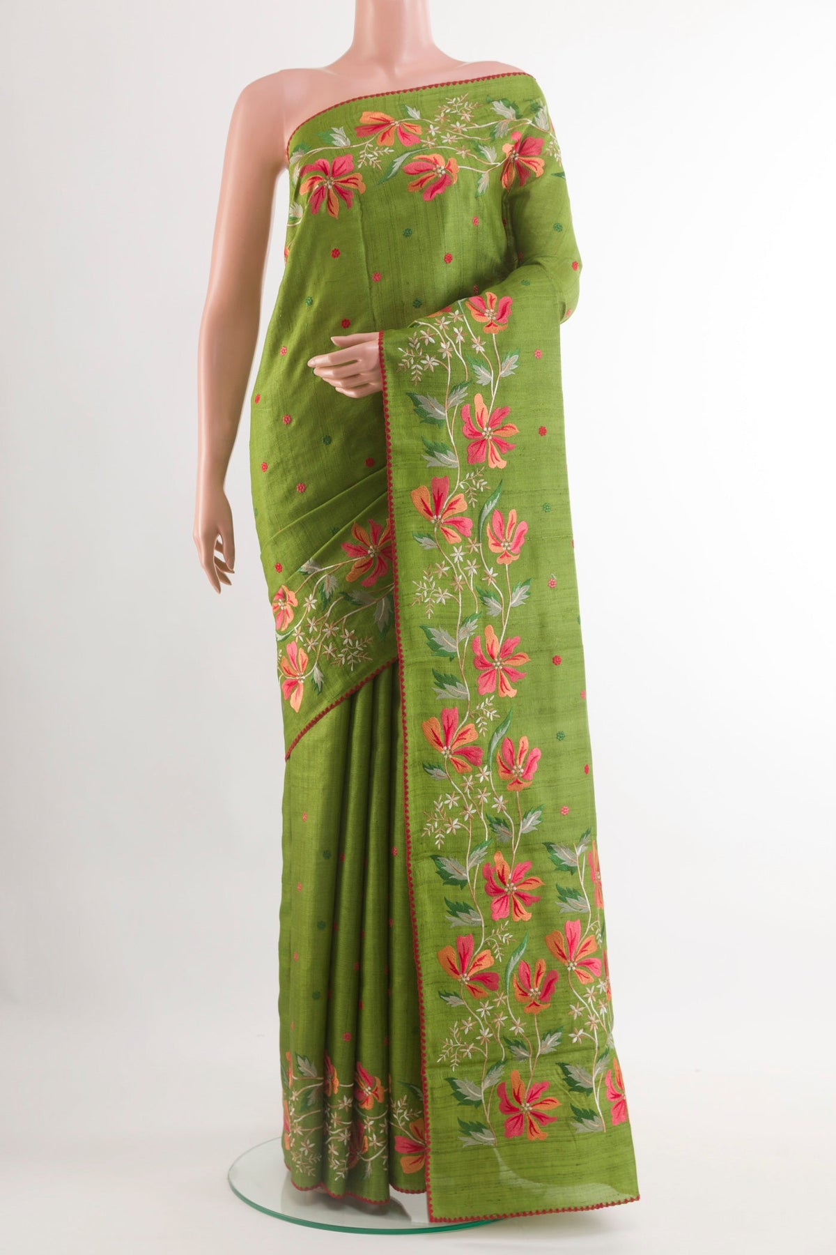 Green Tussar Saree with Thread Butta on the body and Zari Border.  displayed on a mannequin