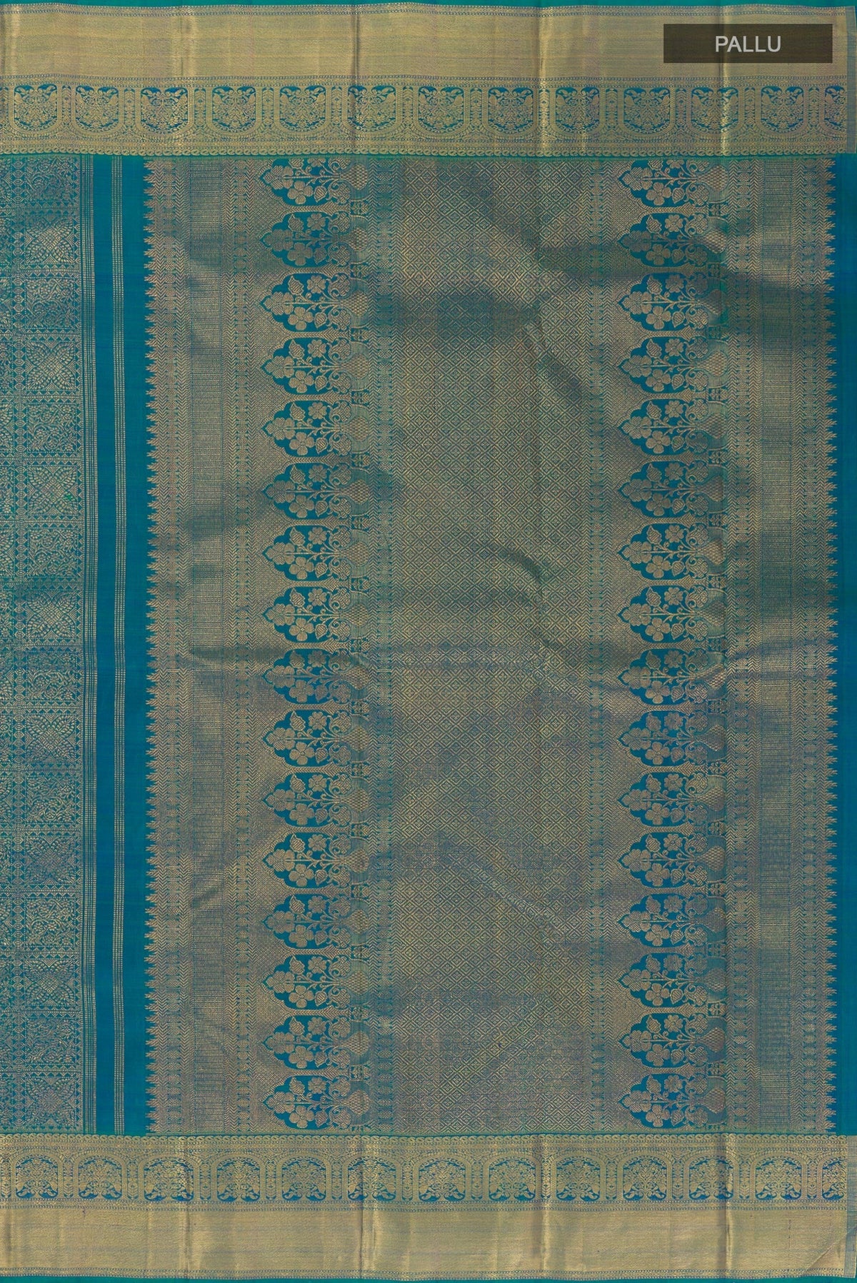 Close up image of the pallu of Peacock Blue Kanchipuram Silk Saree with Zari Brocade on the body and Zari Border. 