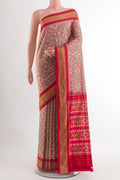 Red Pochampally Silk Saree with Pure Ikat on the body and Zari Border.  displayed on a mannequin