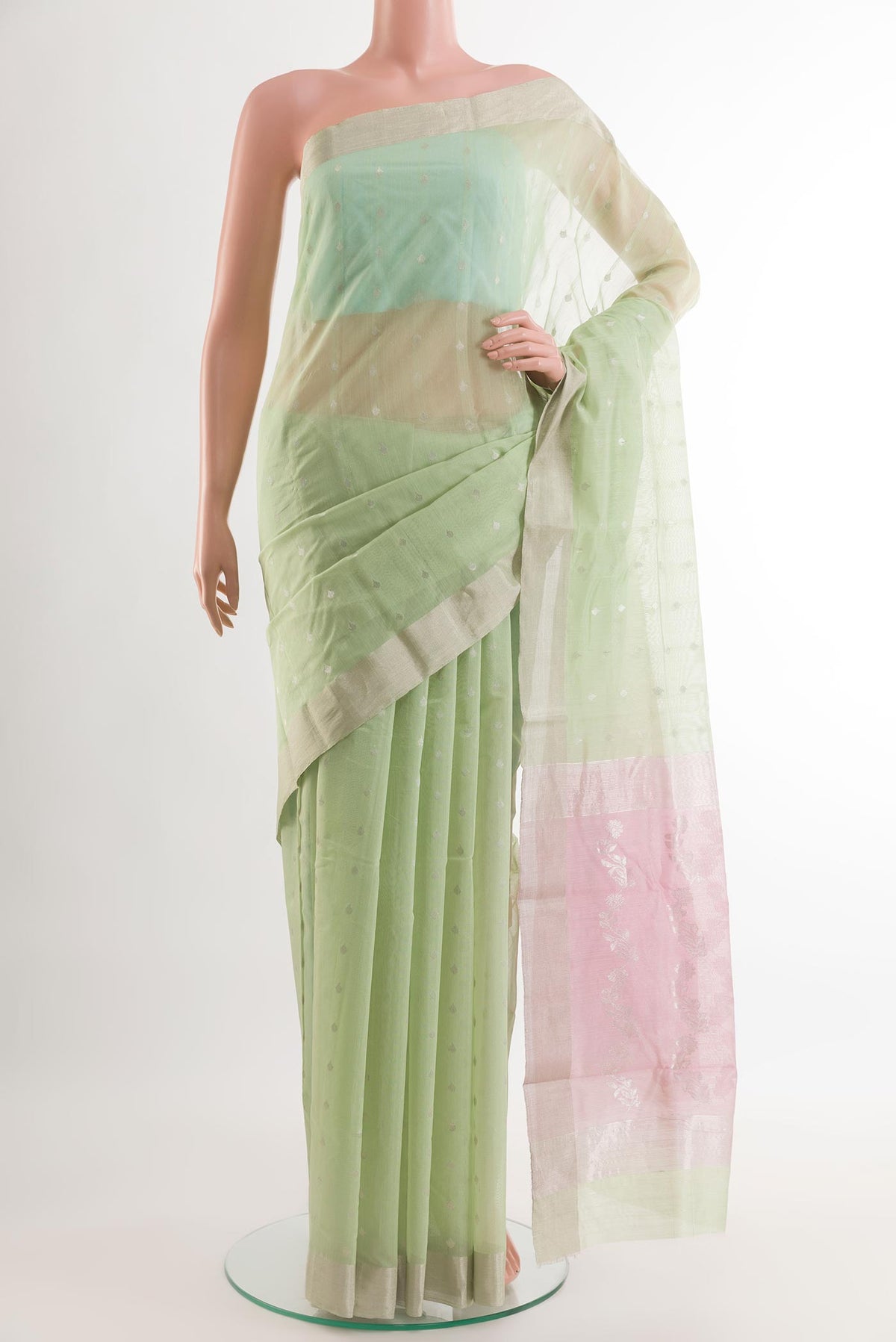 Mint Green Chanderi Silk Saree with Zari Butta on the body and Zari Border.  displayed on a mannequin