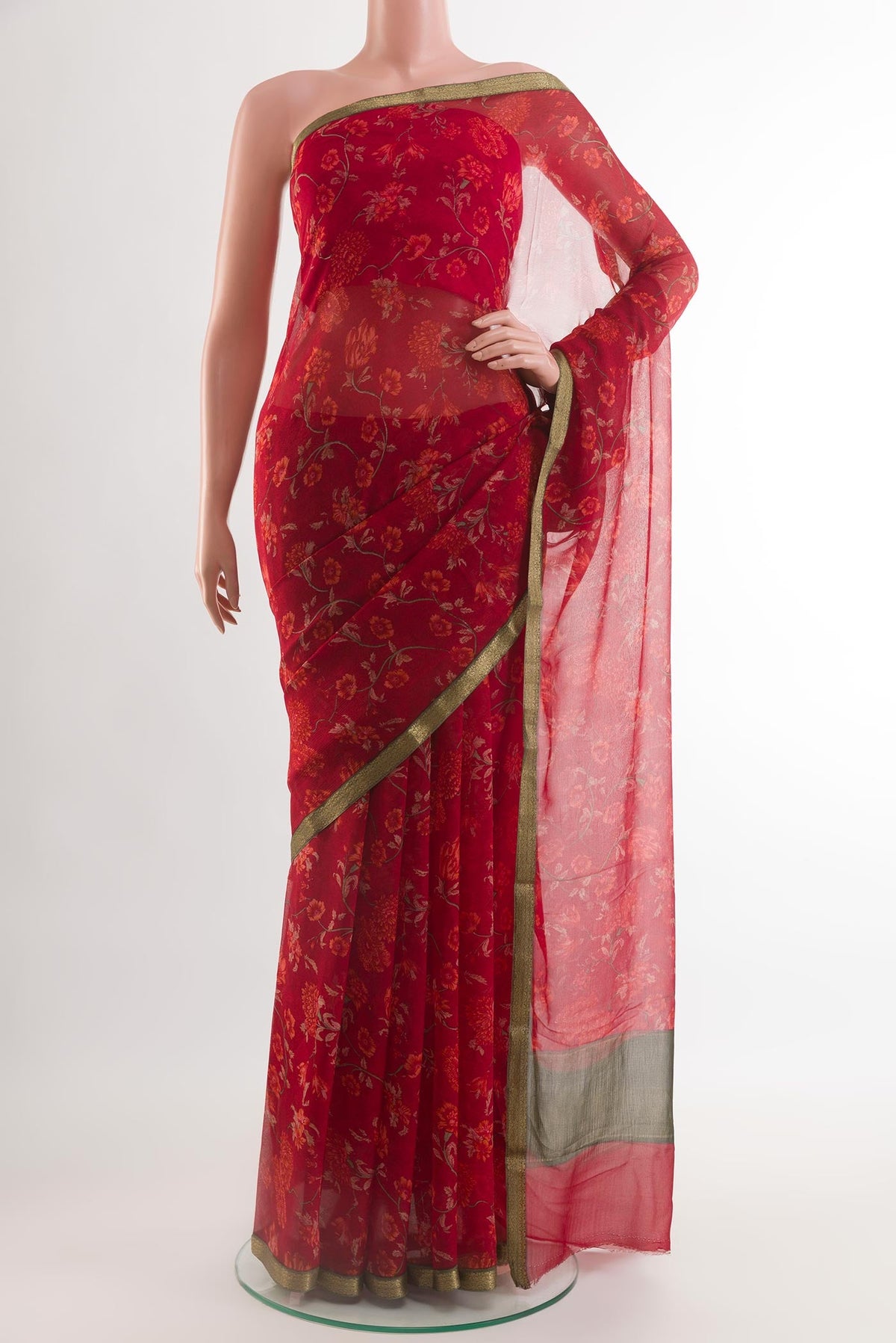 Red Chiffon Saree with Printed design on the body and Plain Border.  displayed on a mannequin