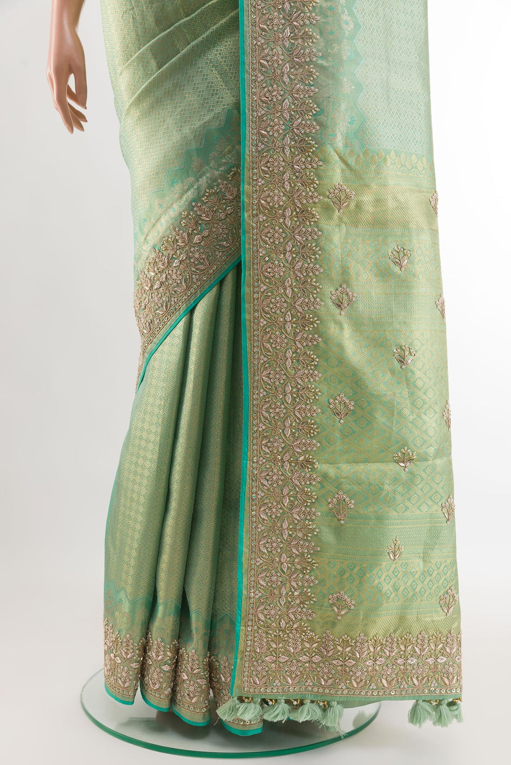 Pleats and pallu of Sea Green Kanjivaram Tissue Silk Saree with Zari Butta on the body and Embroidery Border. 
