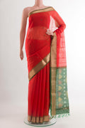 Red Kora Silk Saree with Zari Butta on the body and Zari Border.  displayed on a mannequin