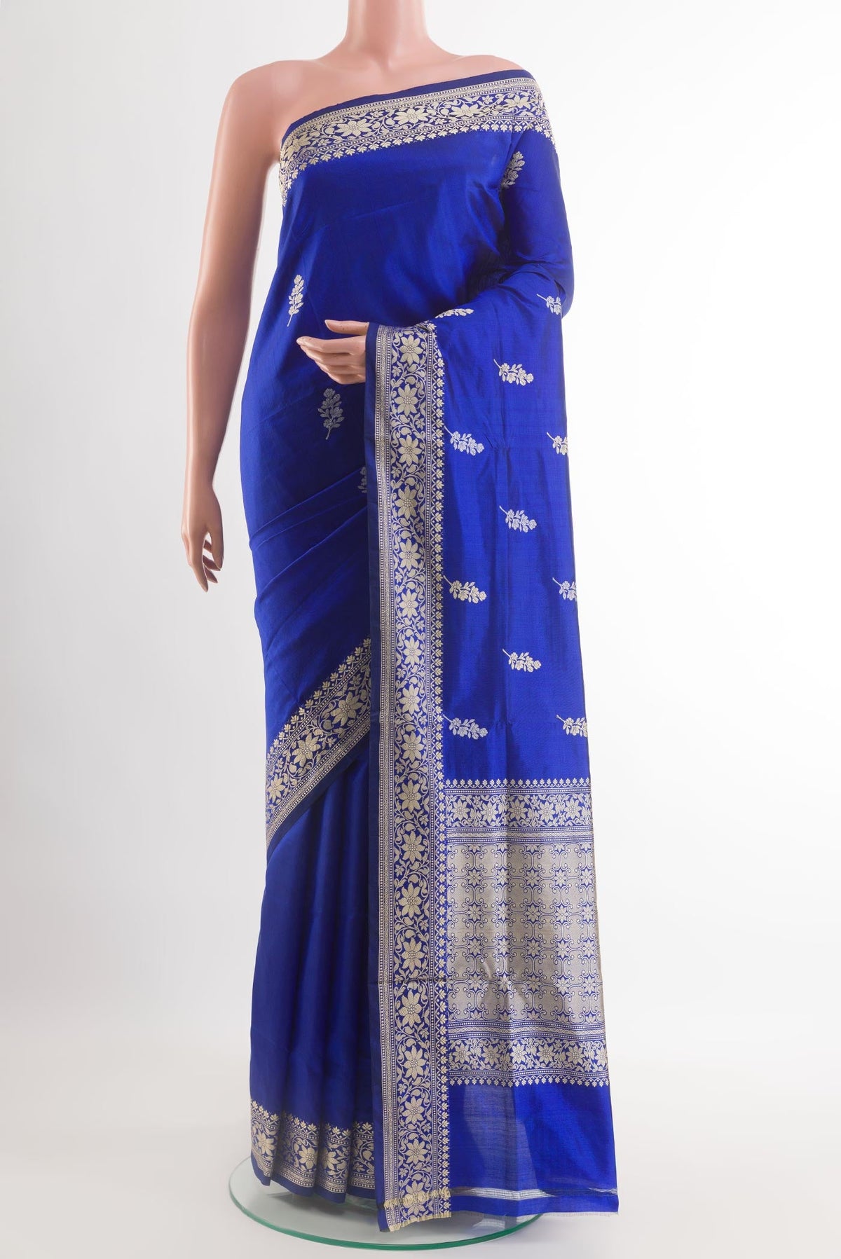 Blue Banarasi Katan Silk Saree with Zari Butta on the body and Zari Border.  displayed on a mannequin