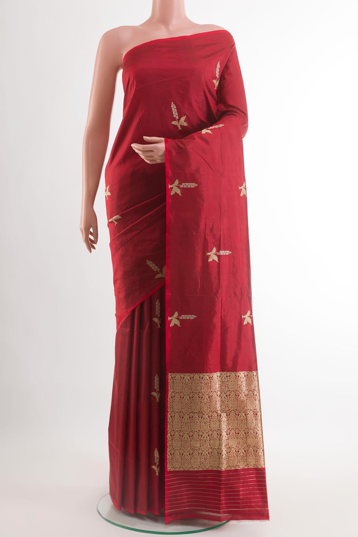 Red Banarasi Silk Saree with Zari Butta on the body and Zari Border.  displayed on a mannequin