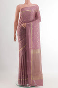Lavender Mysore Crepe Saree with Zari Butta on the body and Zari Border.  displayed on a mannequin