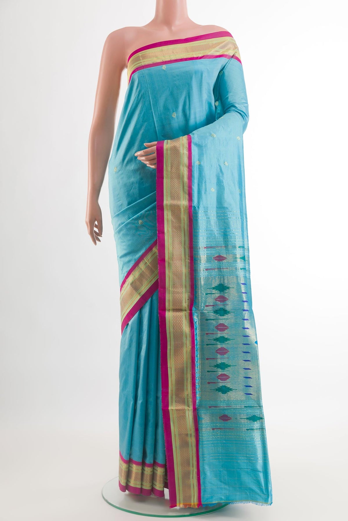Blue Paithani Silk Saree with Zari Butta on the body and Zari Border.  displayed on a mannequin