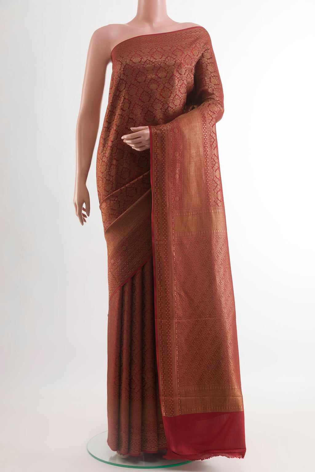 Green Mysore Crepe Saree with Zari Brocade on the body and Zari Border.  displayed on a mannequin
