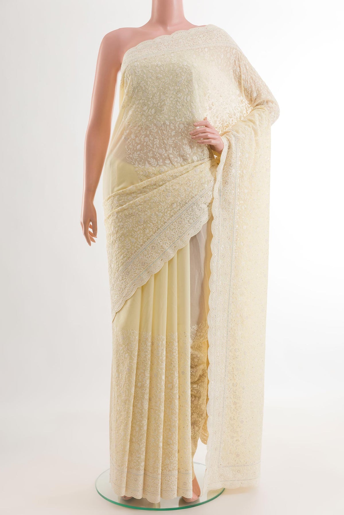 Lemon Yellow Blended Georgette Saree with Embroidery on the body and Embroidery Border.  displayed on a mannequin