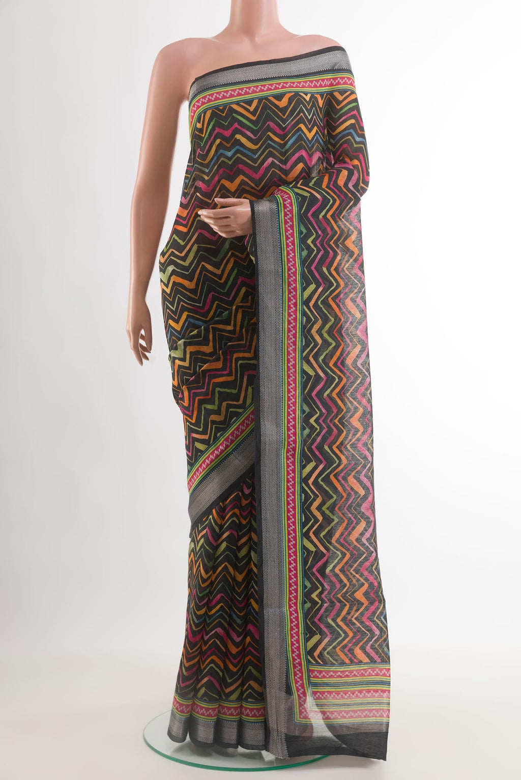 Black Tussar Silk Saree with Printed design on the body and Zari Border.  displayed on a mannequin