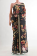 Black Tussar Saree with Floral Print on the body and Zari Border.  displayed on a mannequin