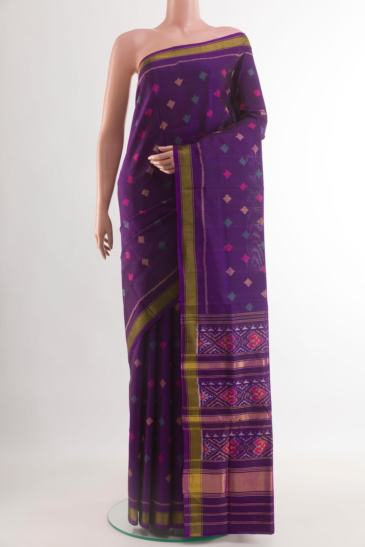 Violet Rajkot Patola Silk Saree with Pure Ikat on the body and Zari Border.  displayed on a mannequin