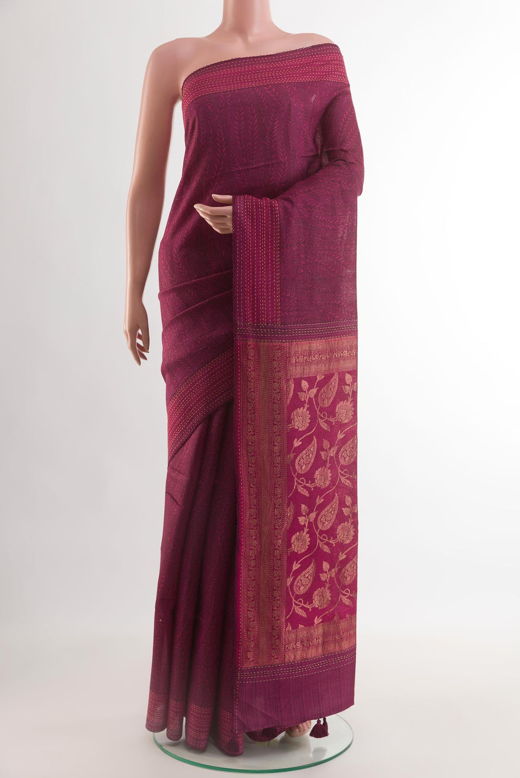 Maroon Tussar Silk Saree with Stripes on the body and Thread Border.  displayed on a mannequin