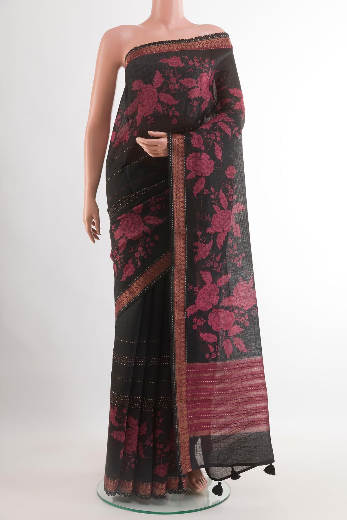 Black Tussar Saree with Stripes on the body and Zari Border.  displayed on a mannequin