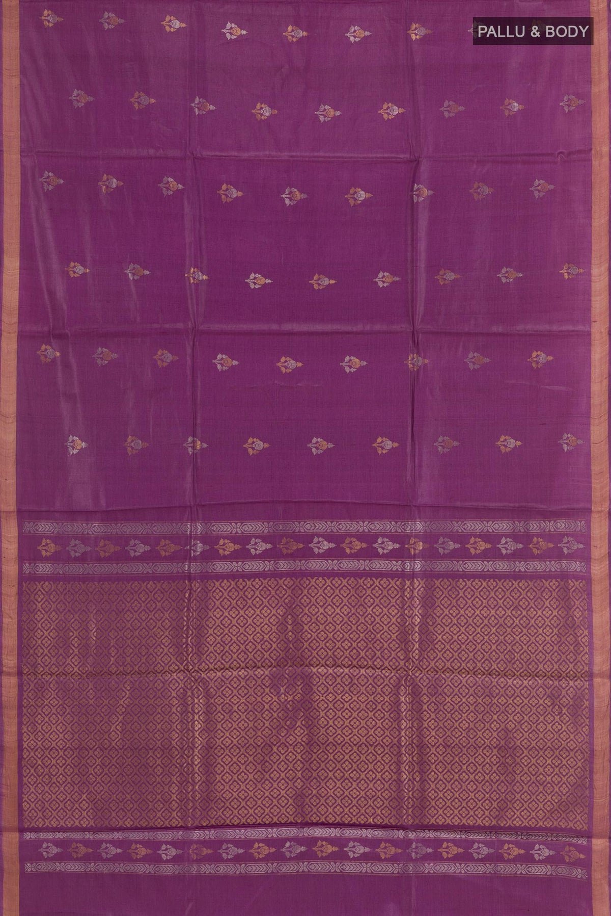 Flat view of Purple Tussar Saree with Zari Butta on the body and Zari Border. 