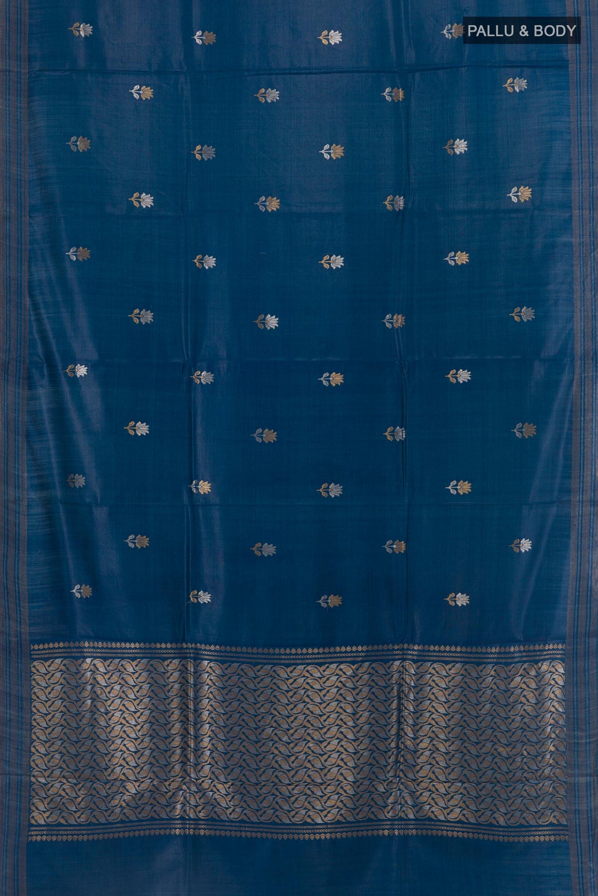 Flat view of Blue Tussar Silk Saree with Zari Butta on the body and Zari Border. 