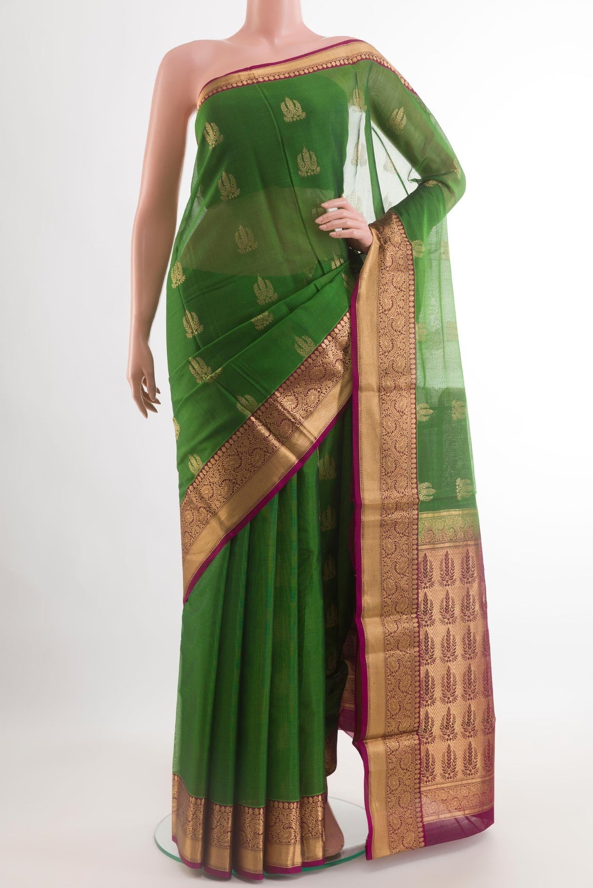 Green Blended Kora Cotton Saree with Zari Butta on the body and Zari Border.  displayed on a mannequin