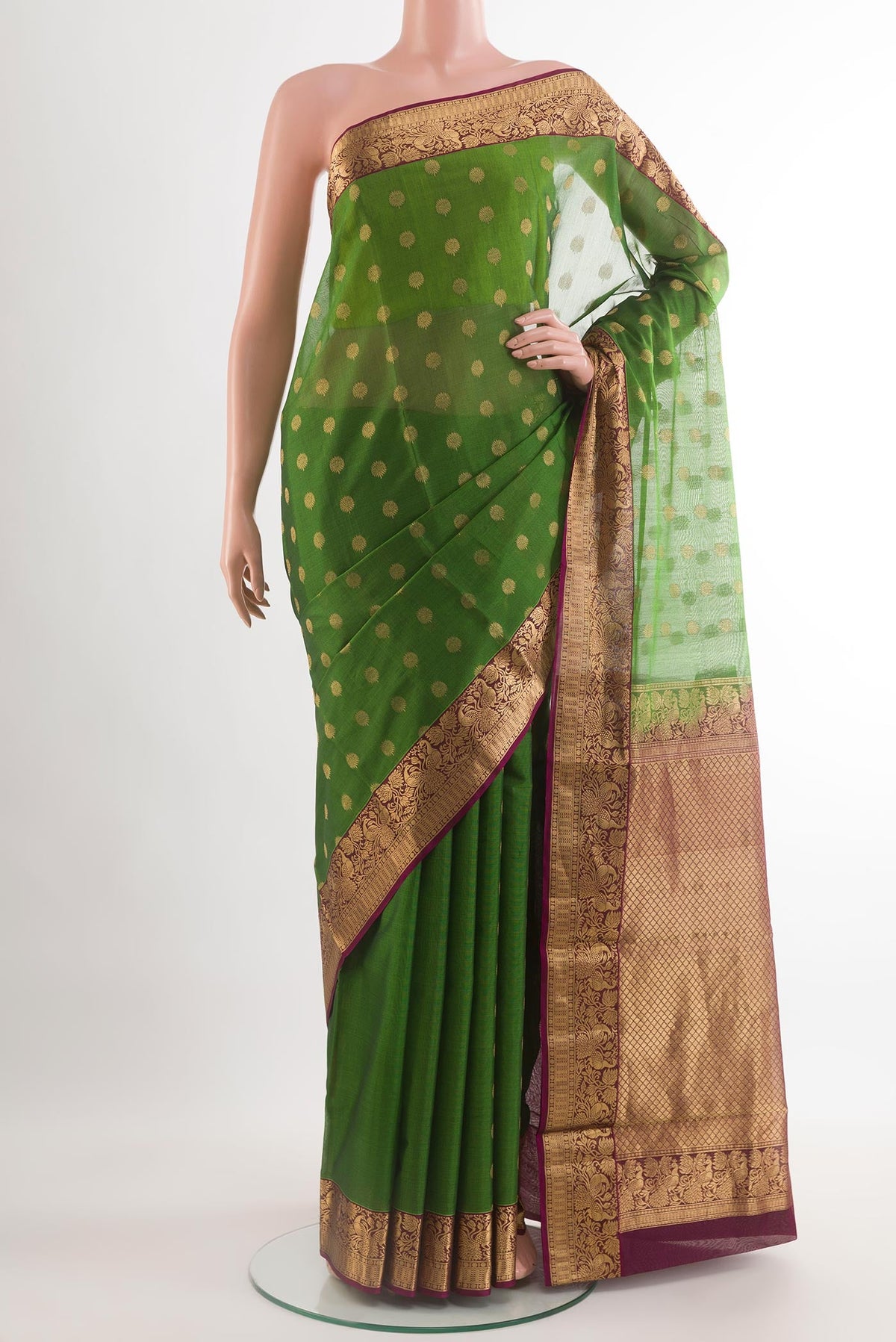 Green Silk Cotton Saree with Zari Butta on the body and Zari Border.  displayed on a mannequin