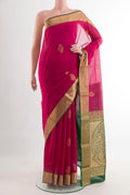 Pink Silk Cotton Saree with Zari Butta on the body and Zari Border.  displayed on a mannequin