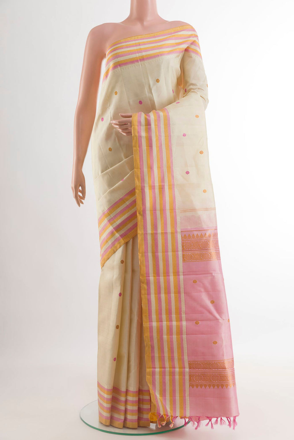 Off White Kanjivaram Silk Saree with Thread Butta on the body and Thread Border.  displayed on a mannequin