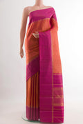 Brick Orange Kanjivaram Silk Saree with Checked design on the body and Zari Border.  displayed on a mannequin