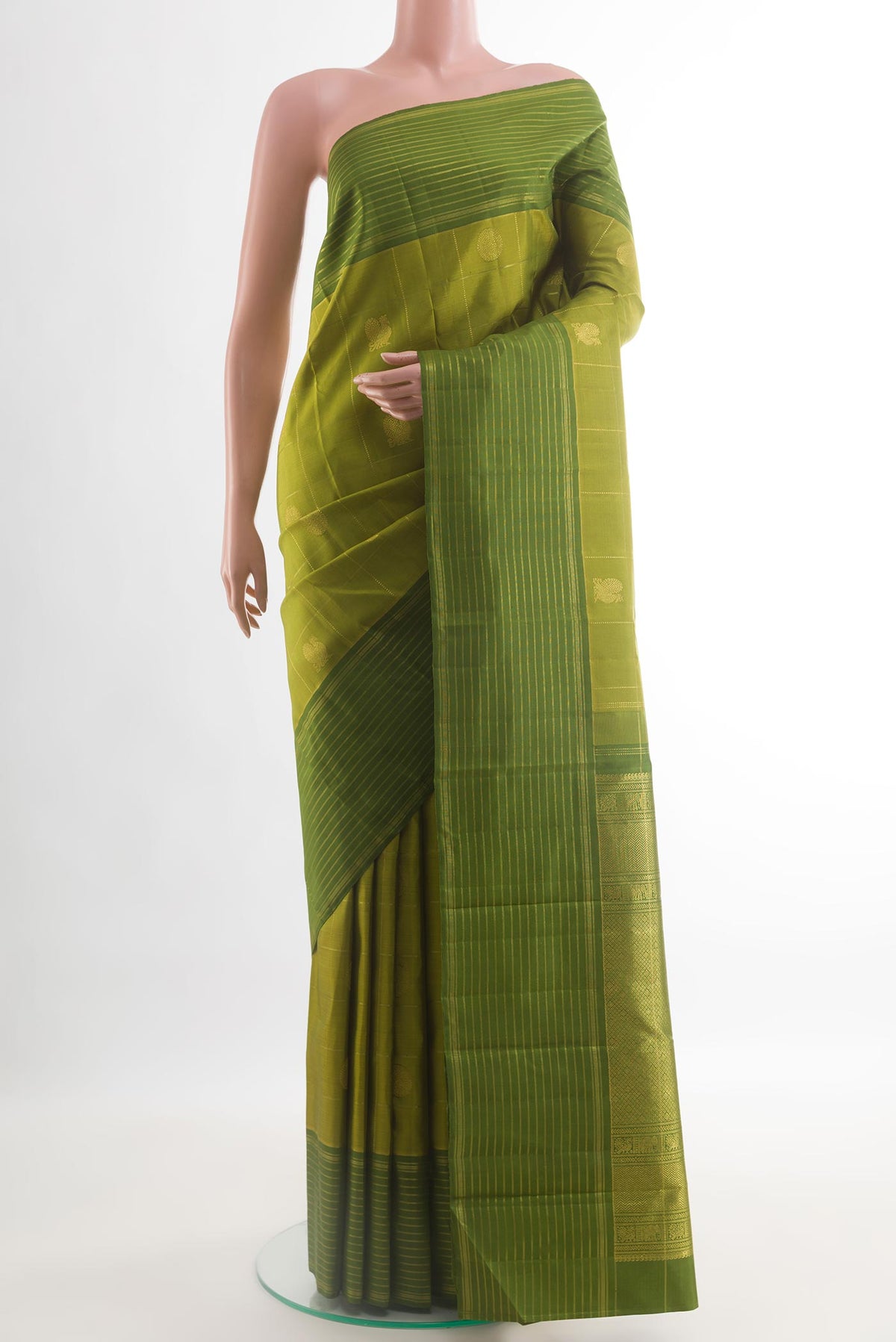 Mehandi Green Kanjivaram Silk Saree with Checked design on the body and Zari Border.  displayed on a mannequin